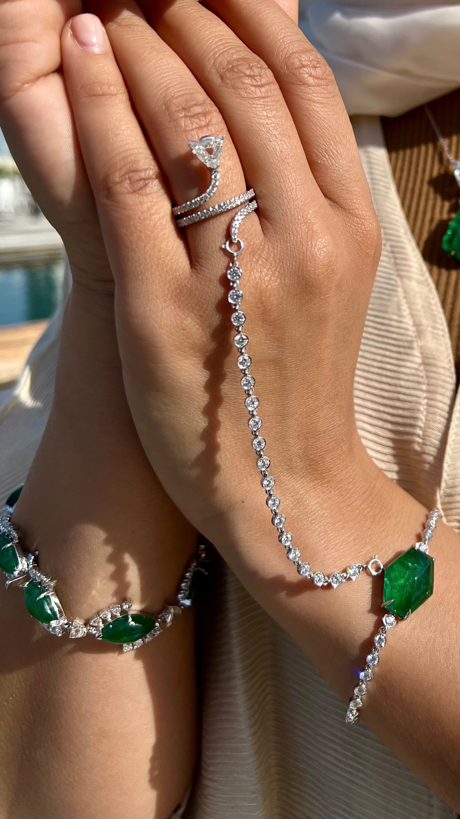 Diamond and emerald hand bracelet